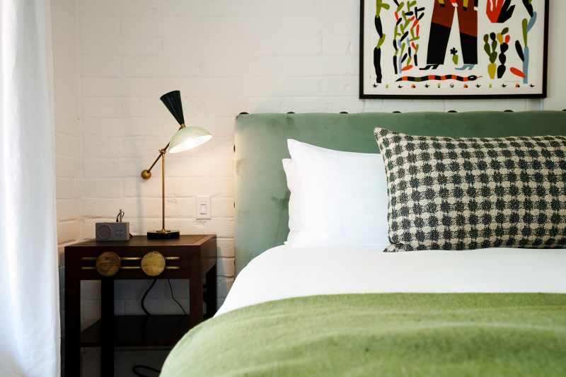 Photo of bed and nightstand at River Lodge