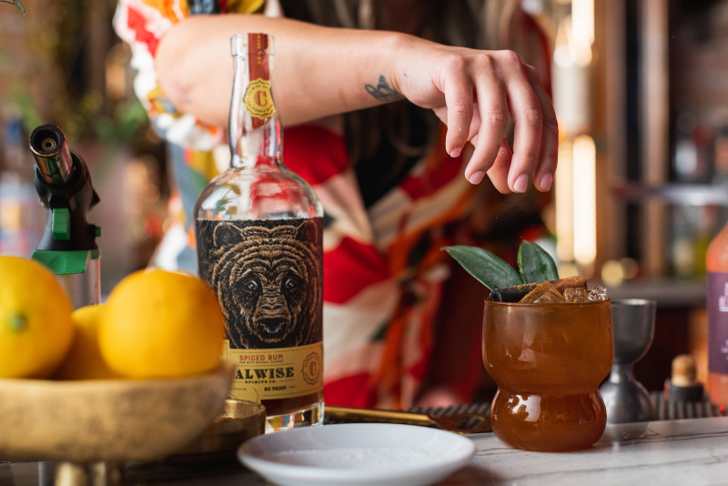 Bartender garnishing cocktail