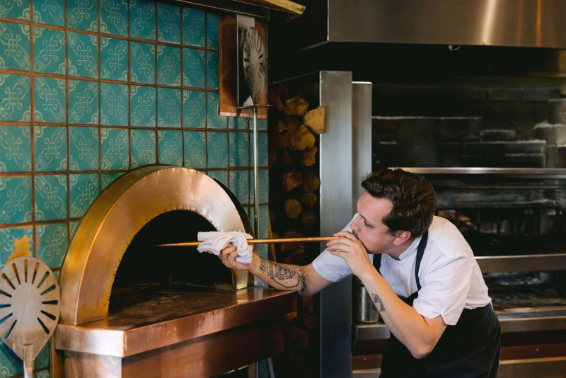 Chef adding oxygen to oven at Ember Restaurant
