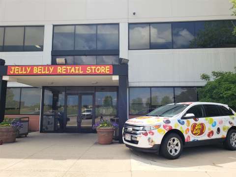 Jelly Belly bean car at entrance with store sign