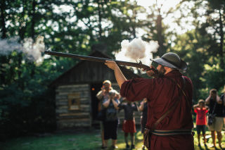 Visitors learn about Revolutionary War-era weaponry.