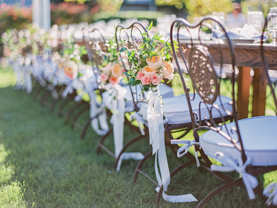 Beautiful Brushed Bronze Chairs with Floral Arrangements