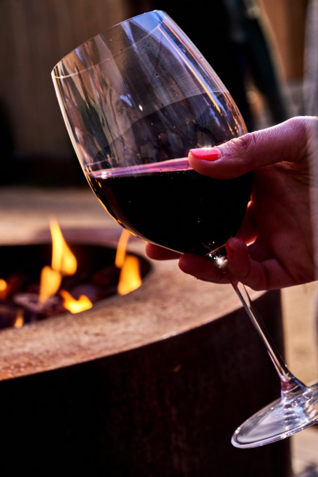 Enjoy a glass of wine by the fire