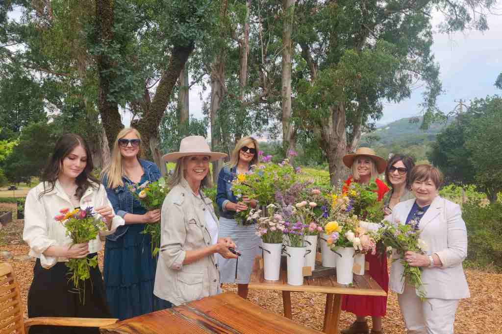 Group participating in floral workshop and winetasting