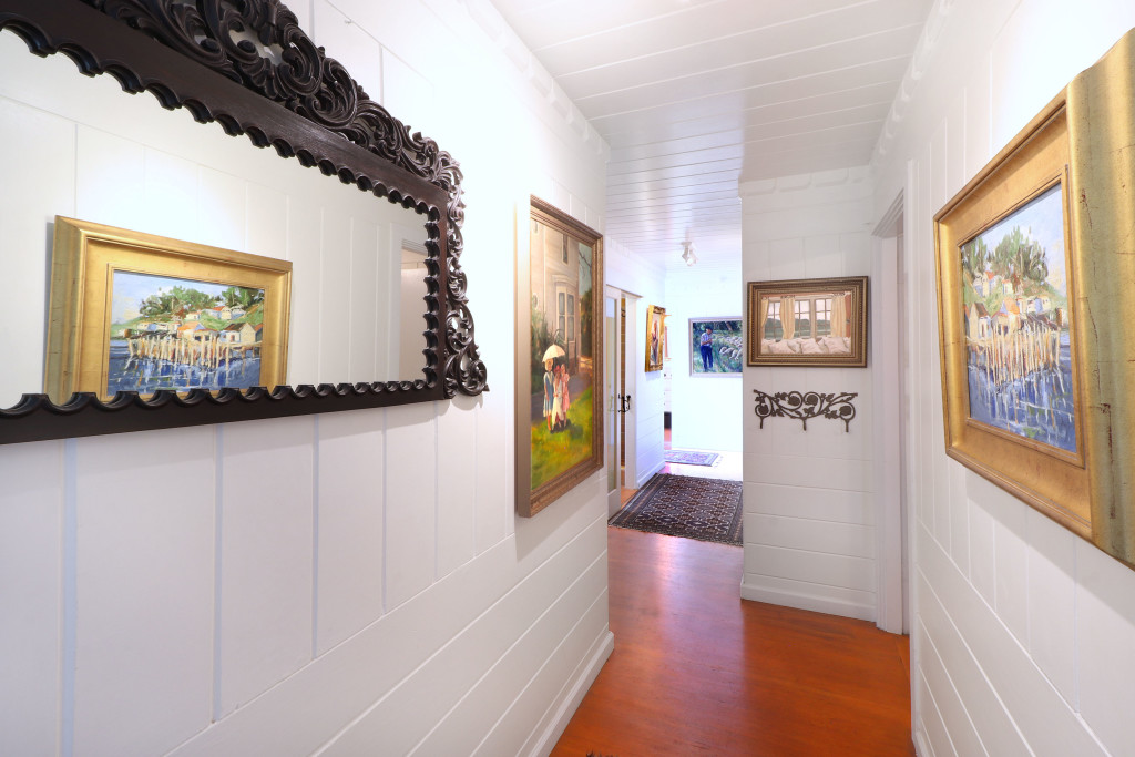 The 3 bedrooms on the entry level open to this hallway