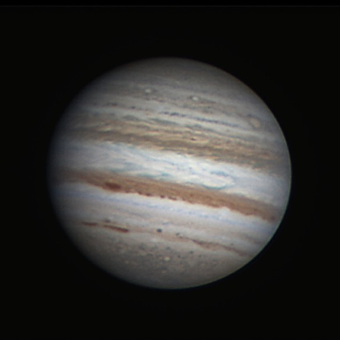 See Cloud Belts and Moons of Giant Jupiter