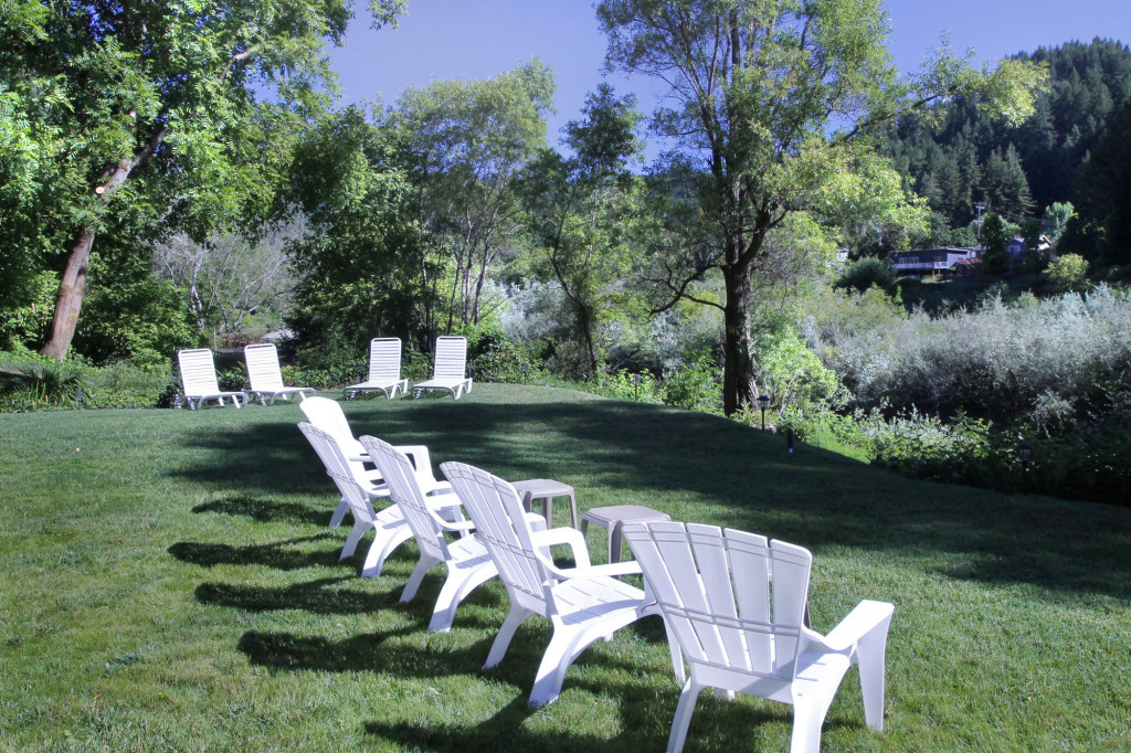 Lawn chair and loungers overlooking the river