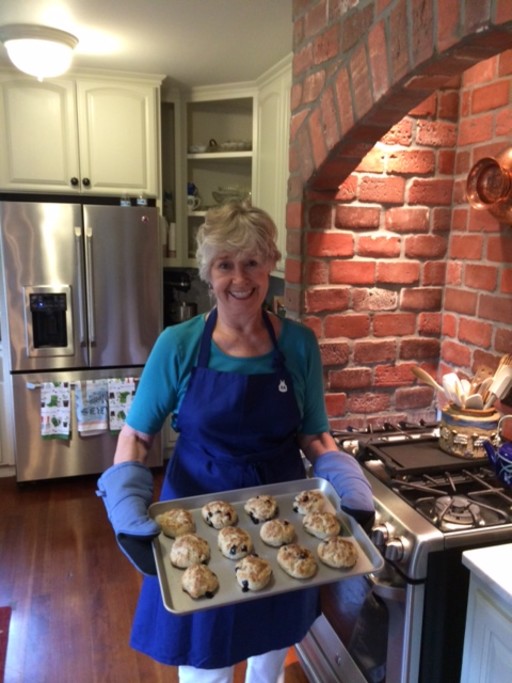 Sandy taking scones from oven.