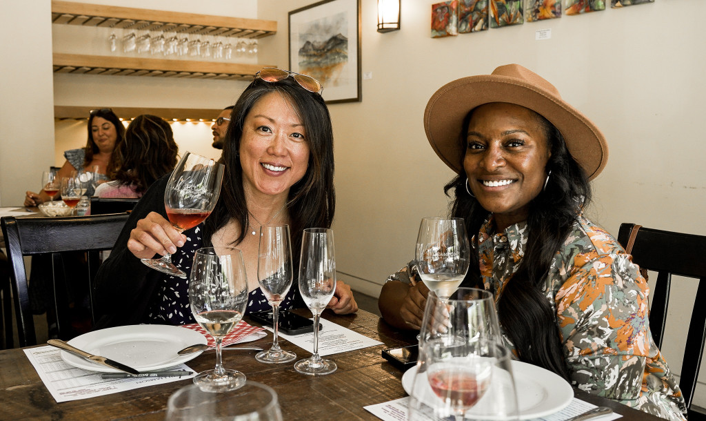 Friends at 18 - Friends sit and enjoy our wine and food pairing