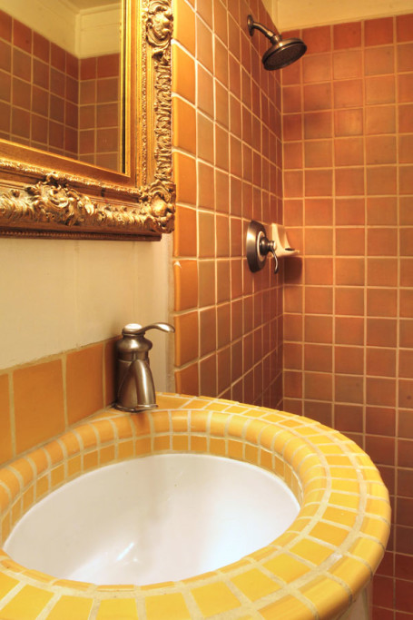 The tile shower in the first full bath.