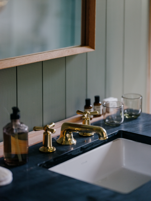 A custom designed spa bathroom features Frette© bath towels, Waterworks© bathroom fixture