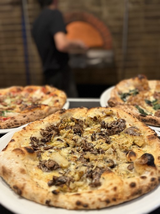 Rosso Pizzeria & Wine Bar - Pizza Brick Oven - One of the top sellers! The Funghi Di Limone: Oven roasted mixed mushrooms, taleggio and fontina cheese, shaved artichokes, finished with lemon oil and fresh thyme
