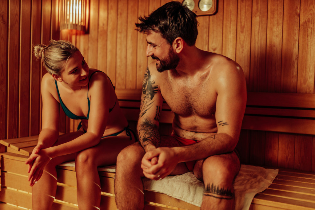 Peak Wellness Studio - Young Couple Enjoying the Sauna