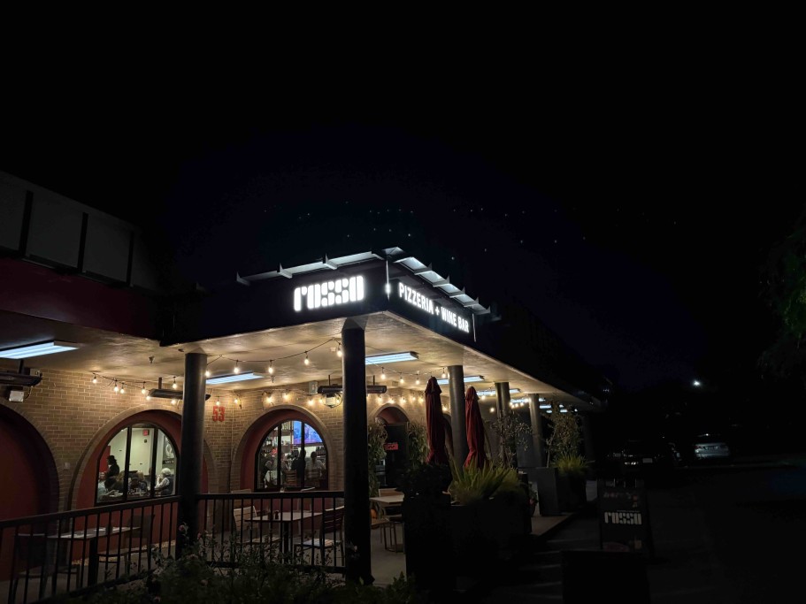 Rosso Pizzeria & Wine Bar - Exterior - Our restaurant in the evening. Free parking, ample!