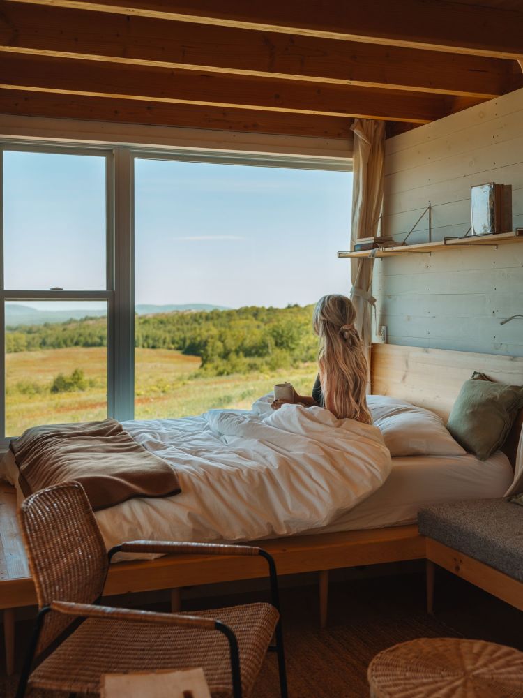 A guest taking in the expansive 100-mile views all the way to Penobscot Bay.