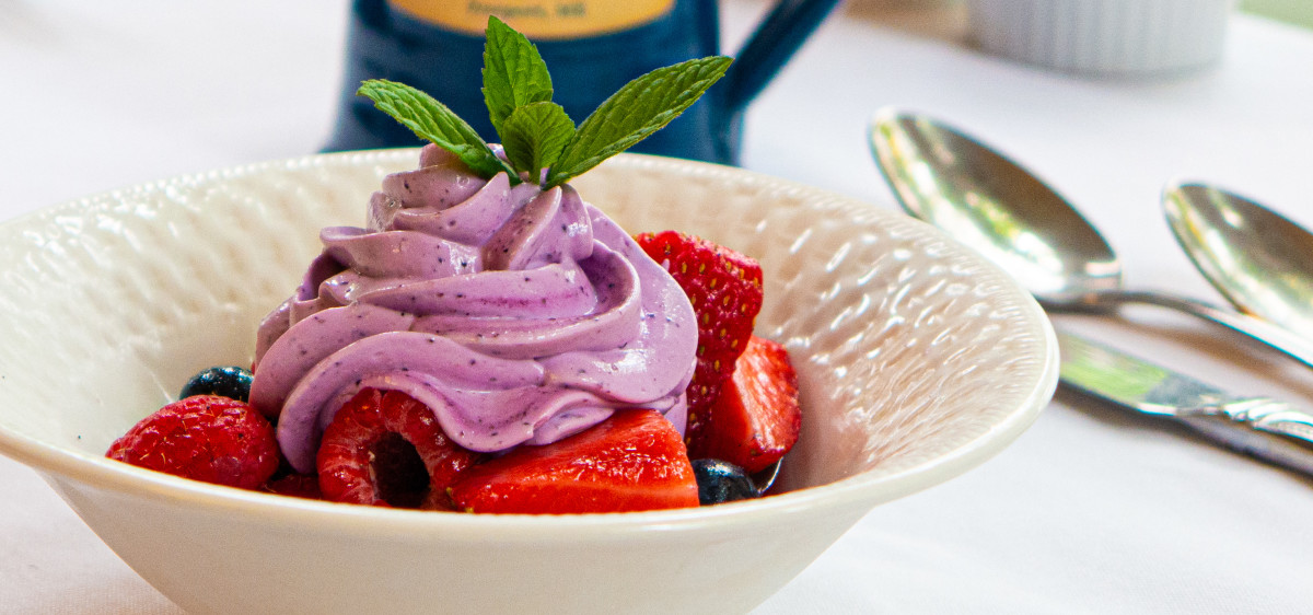 Fresh fruit macerated in cardamom & hibiscus and topped with blueberry yogurt