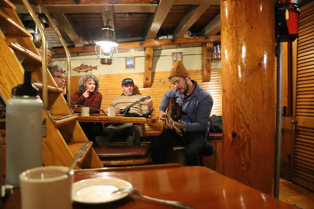 Music in the galley during our Gam trip- Fleet-wide meetup where every boat rafts up for a night.