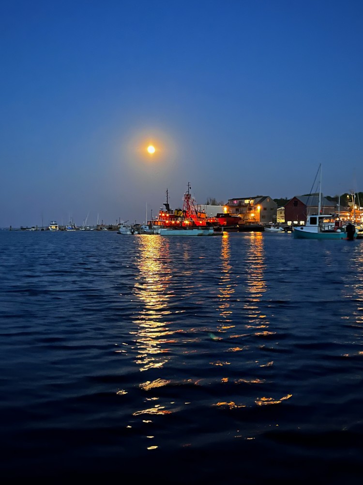 Experience the magic of the full moon rising out on the water in a wooden dory!