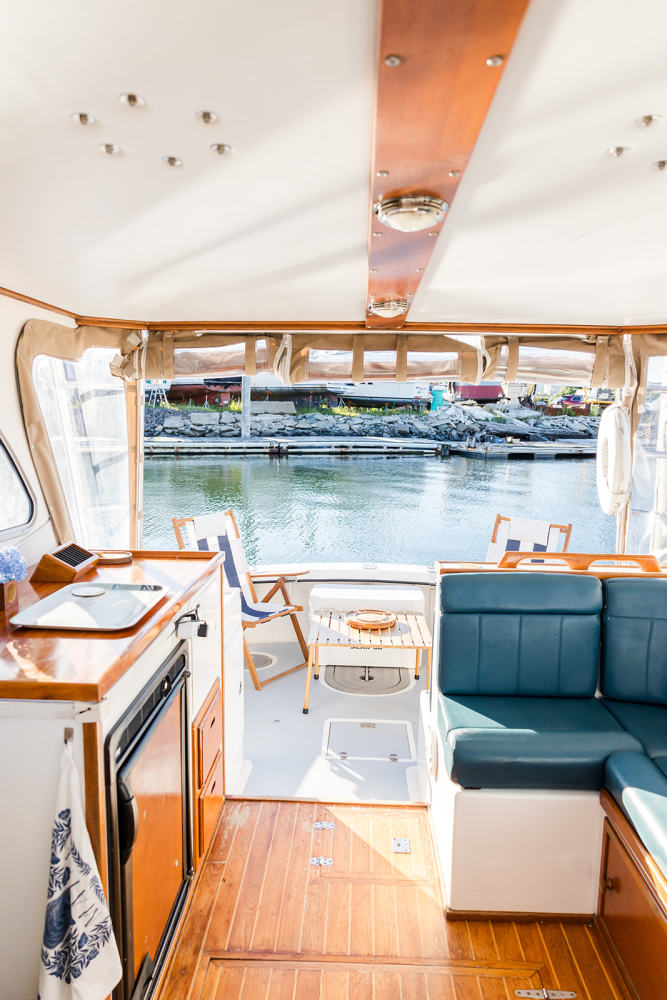 This shows a good look of the inside of the boats cabin facing the back deck.