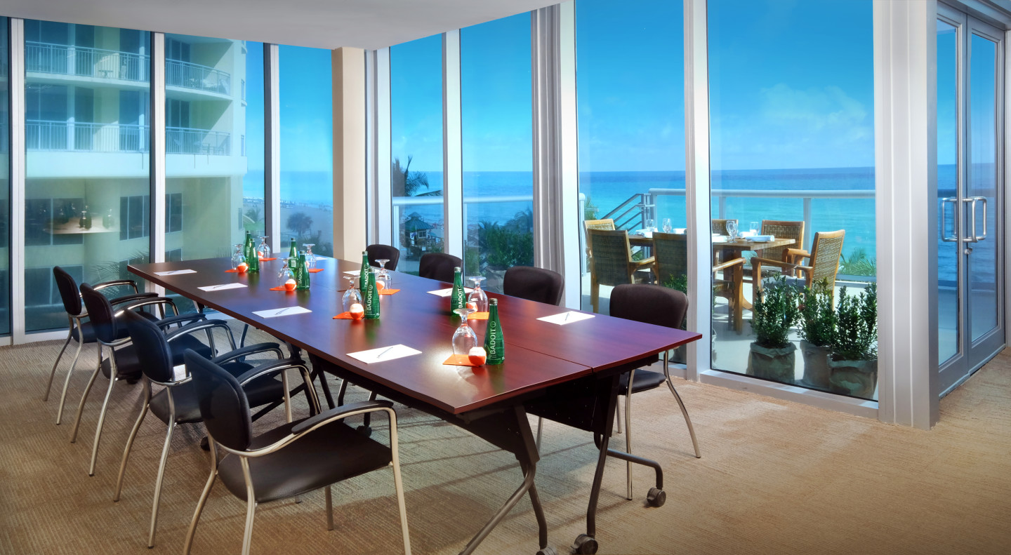 The Corner Office offers floor to ceiling windows that overlook the ocean and has private access to a patio overlooking the ocean, great for smaller meetings with lunch plans. The meeting room is enhanced with state-of-the-art audio visual capabilities.