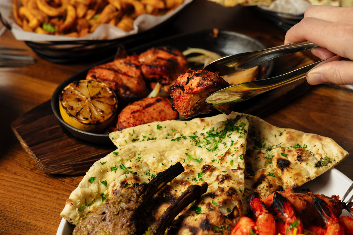 Tandoori Chicken Boti paired with Garlic Naan
