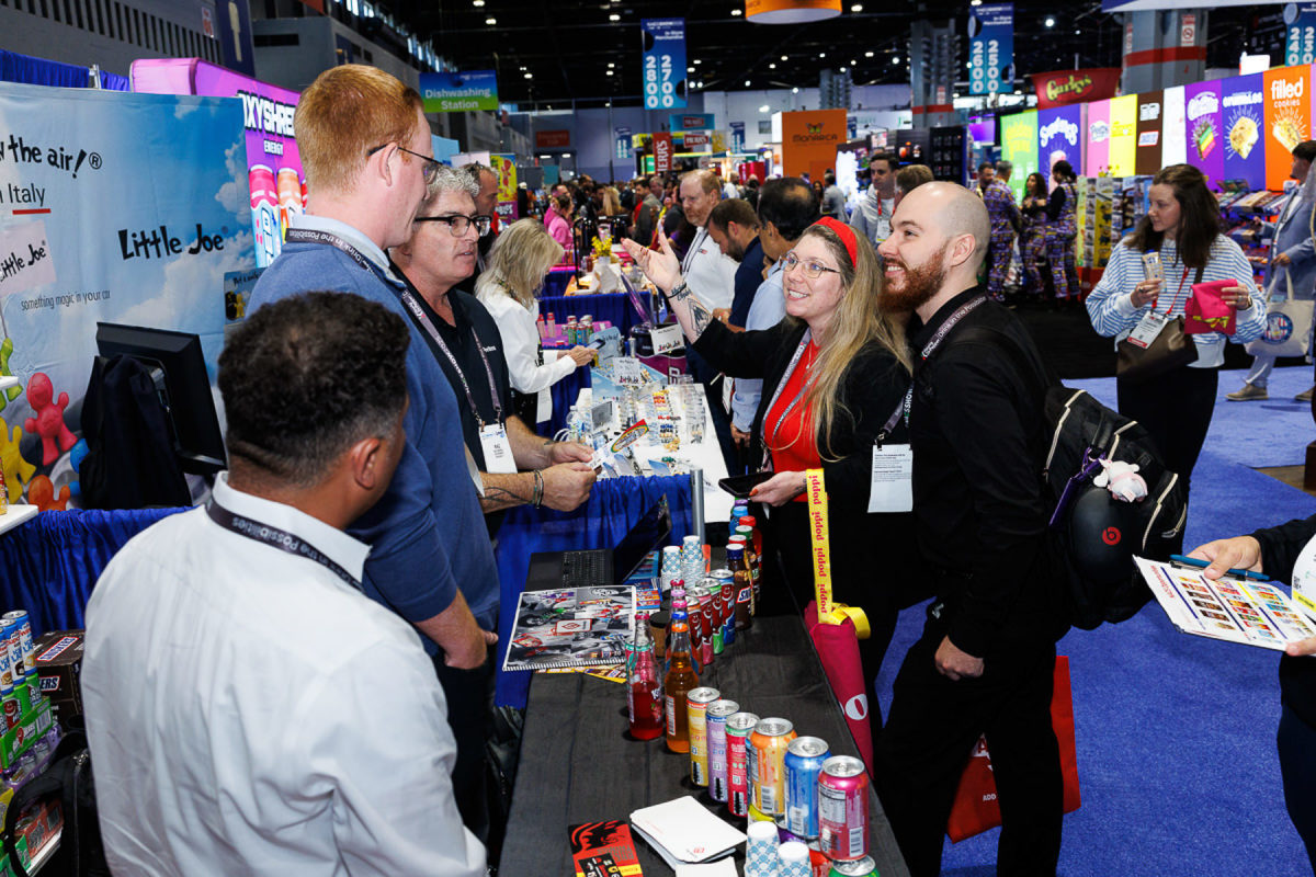 Trade show attendees networking with exhibitors at a Chicago convention