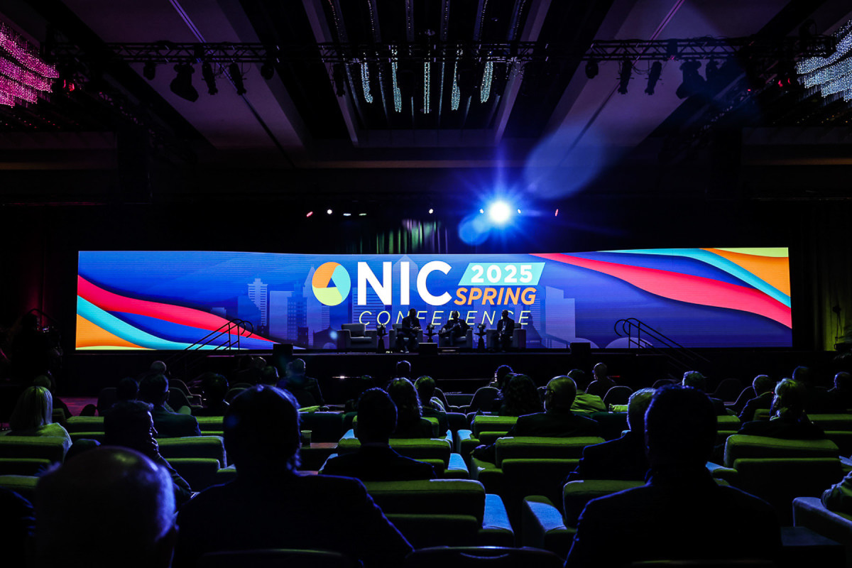 Trade show attendees networking with exhibitors at a Chicago convention
