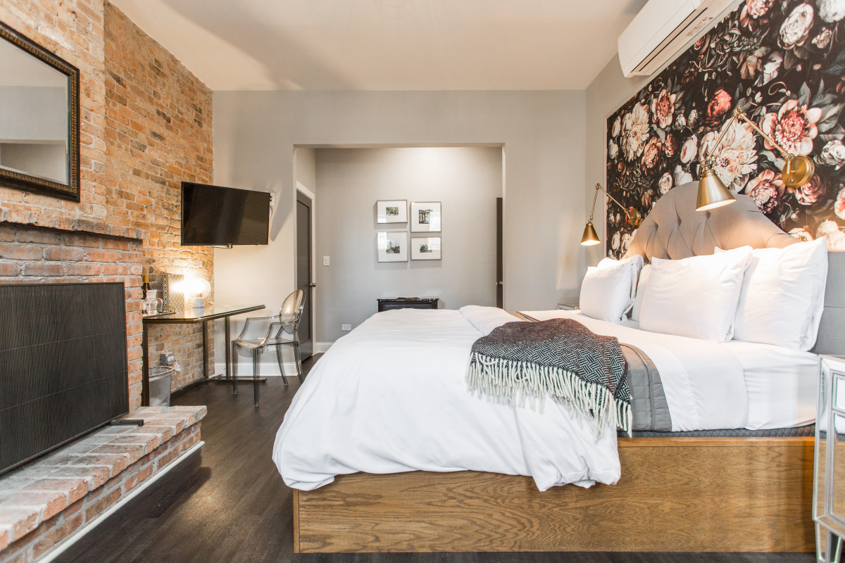 Spacious King guest room with brick fireplace