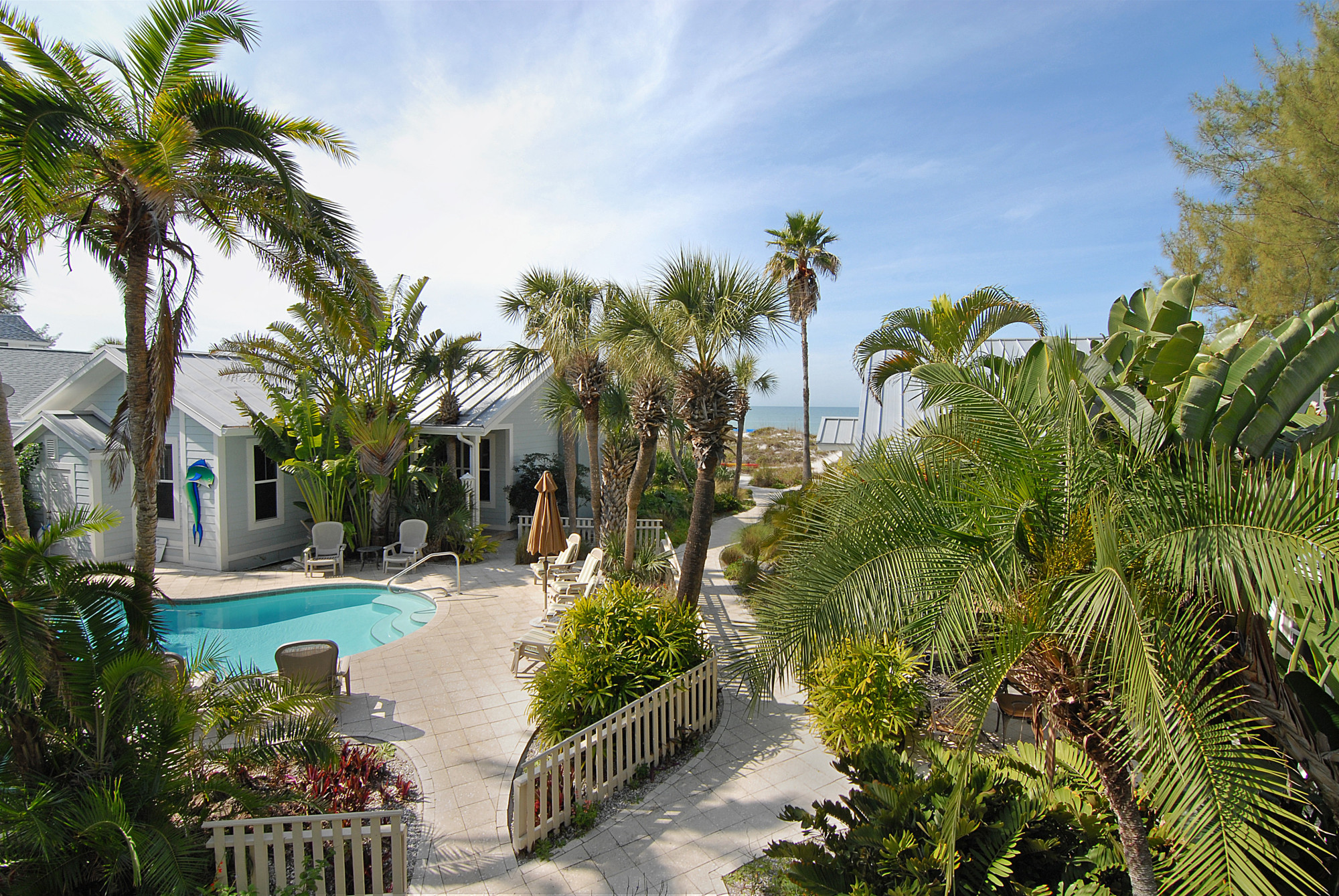 View of property and Gulf from covered patio of 2 bedroom suite