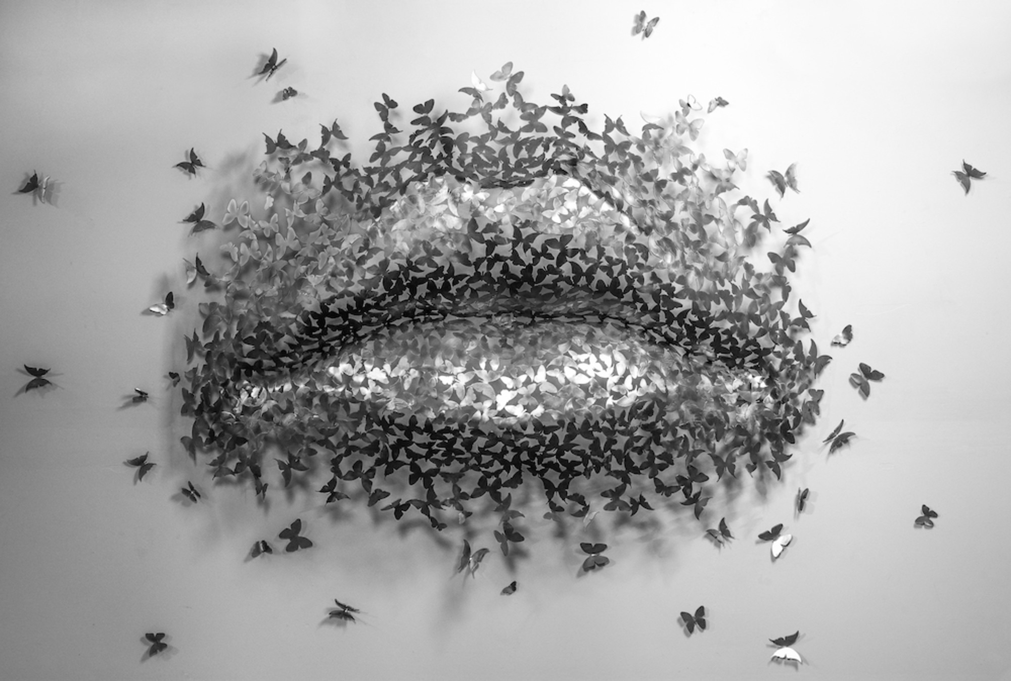 Butterfly Kiss, an oversized pair os stainless steel lips made of stainless steel butterflies