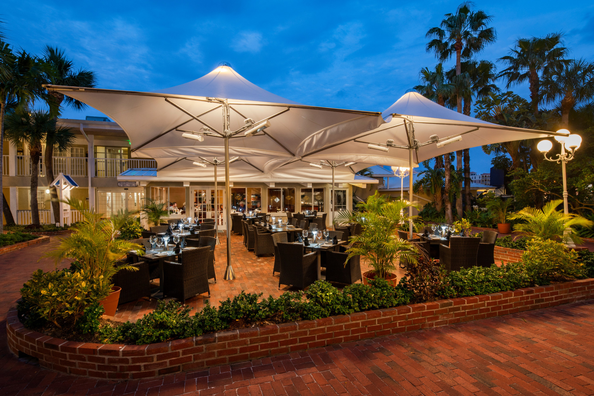 Dine under the stars on the terrace at Palm Court Italian Grill
