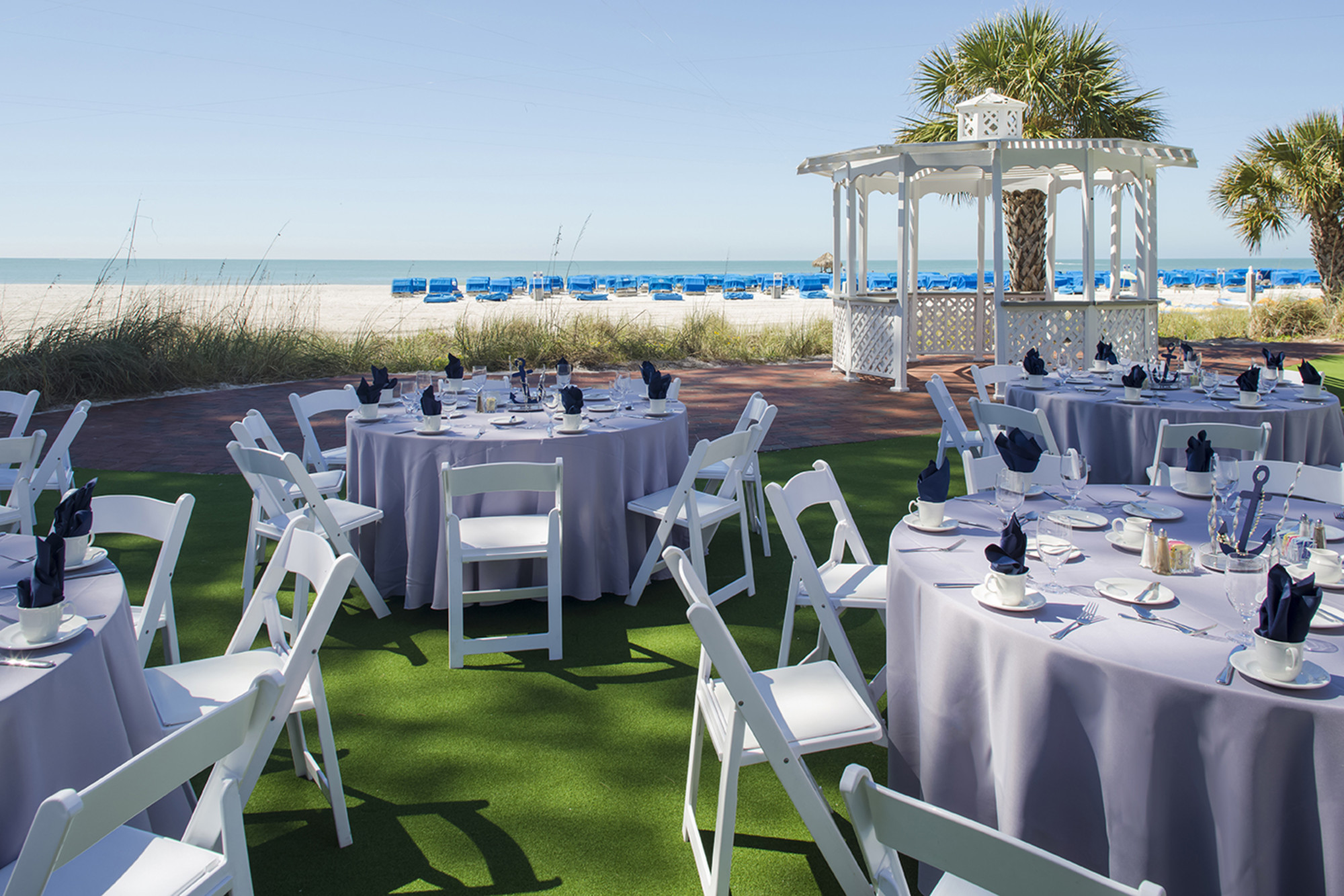 The 2,580 sq. ft. South Beach Lawn set up for a reception with round tables