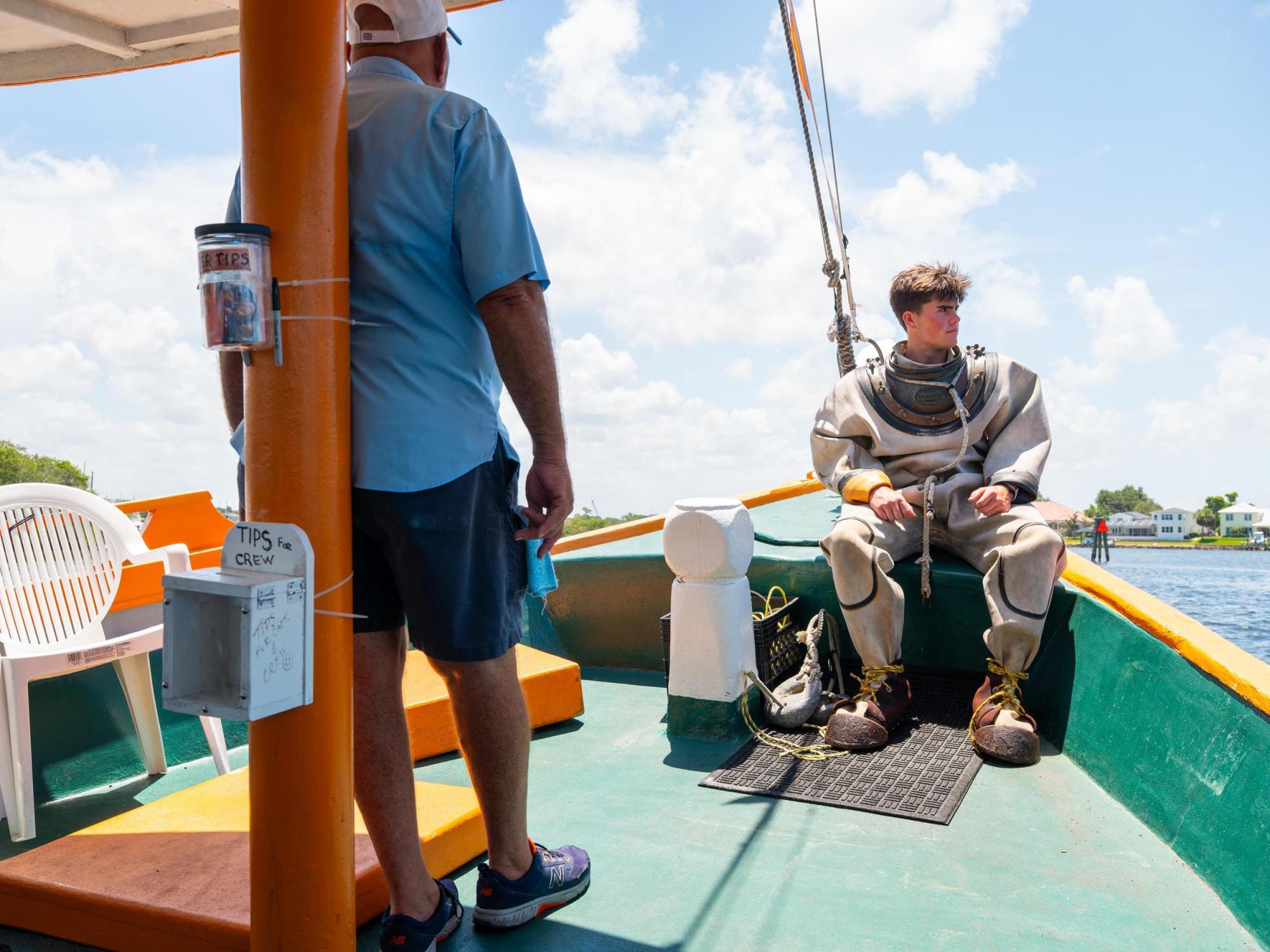 St. Nicholas Boat Lines diver back of boat
