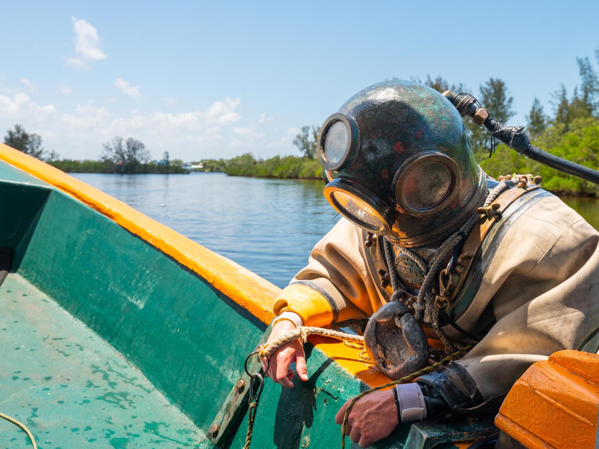St. Nicholas Boat Lines diver descending into water
