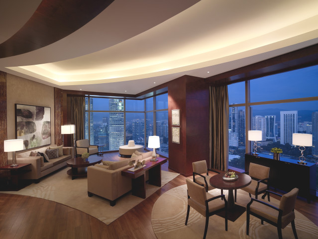 Diplomat Suite - Living Room - Revel in 242 sq m suite with Petronas Twin Towers view, a king bed, spacious living and dining area, kitchenette with bar counter, study room and Grand Club lounge access.