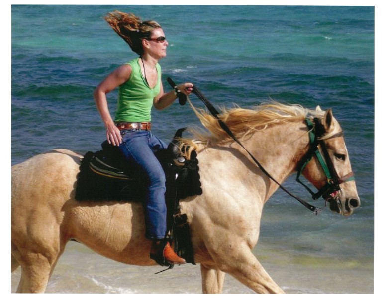 Cantering horse on beach