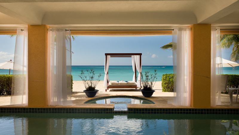 Private pool is covered with views of the beach