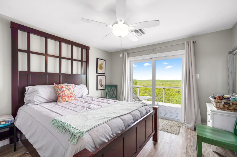Guest Bedroom with King Bed and access to the balcony