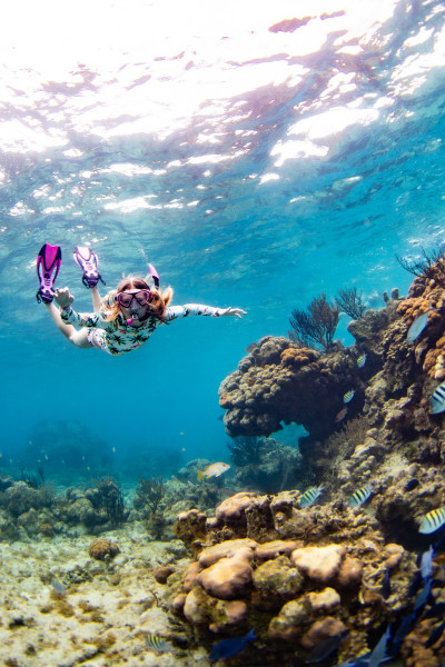 Woman surrounded by fish