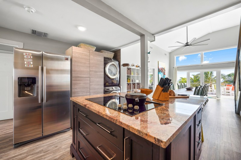 Gourmet Kitchen and dining area with front loading washer and dryer