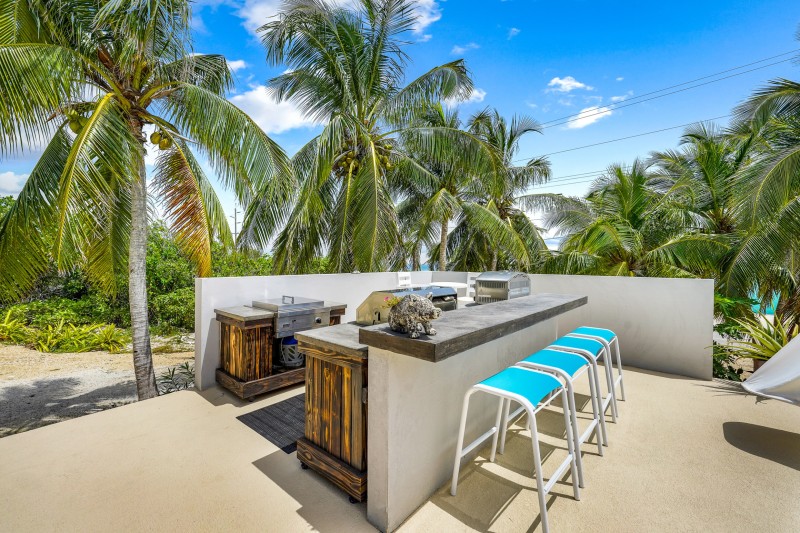Outdoor BBQ and bar located next to the pool