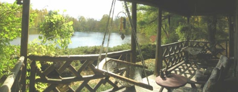                         A view of the secluded lake from the porch at the Hudson Valley Cabin in Stanfordville.
                        