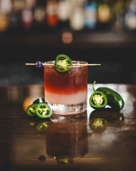                         A crafted cocktail with jalapeno peppers on a toothpick at Panacea in Amenia
                        