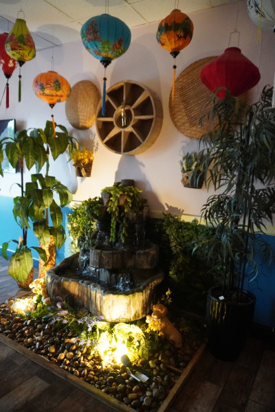                 A colorful shrine welcomes visitors into the restaurant
                