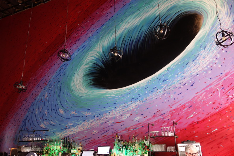                Black-hole-looking mural at the Roosevelt Bar.
                