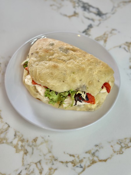                         A sandwich wrap on a plate at Anna et Pierre Le Cafe in Poughkeepsie.
                        