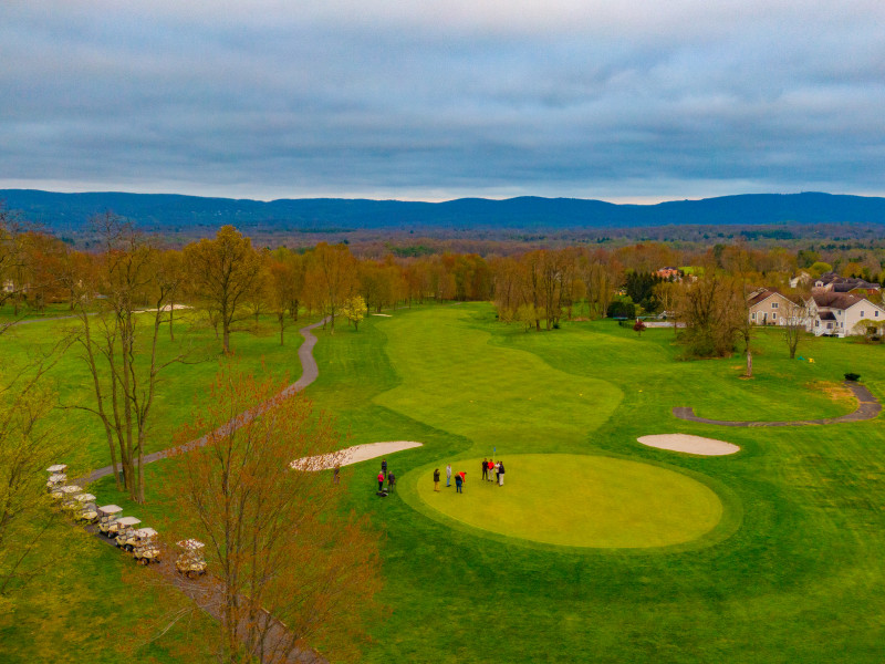                         Aerial photo of Beekman Golf Course showing greens and mountains in the distance.
                        
