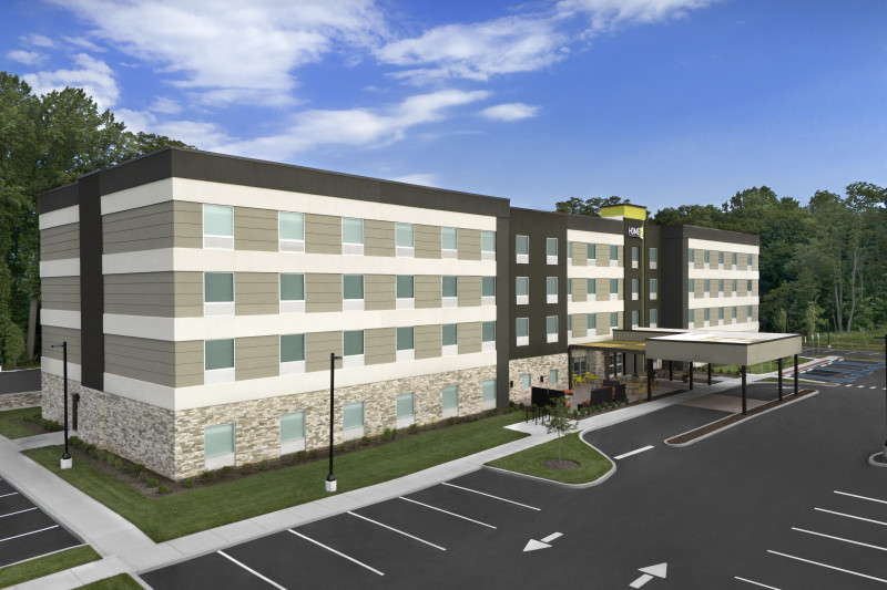                         An exterior shot of the front of Home2 Suites.
                        