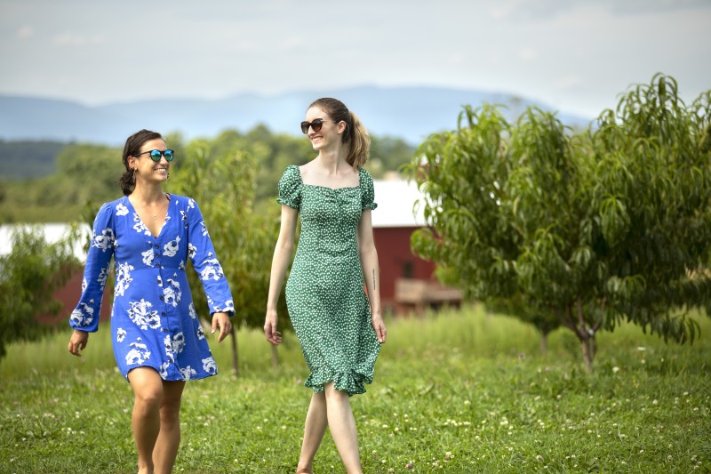                         Two women walking at Rose Hill Farm
                        