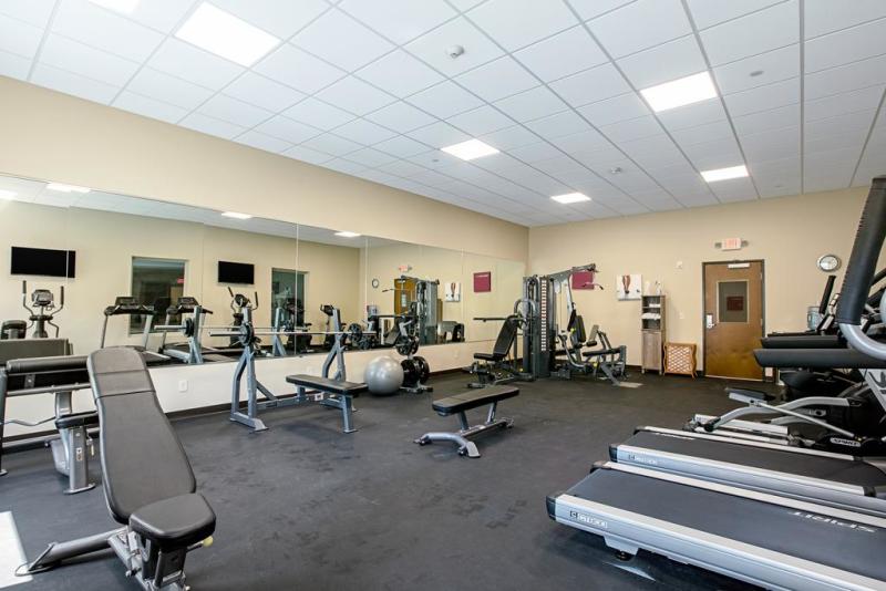                         A view of the fitness center at Comfort Suites with treadmills and assorted exercise equipment.
                        